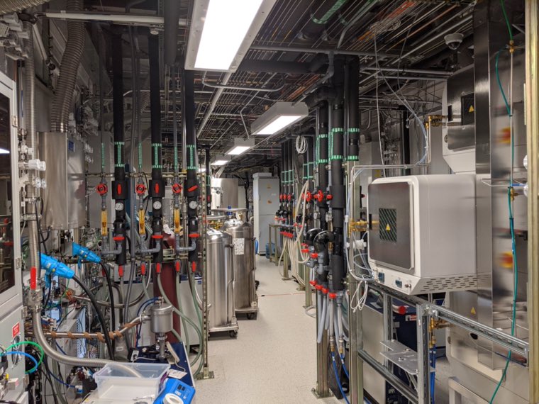 The service corridor behind the cleanroom, full of gas lines and vacuum plumbing