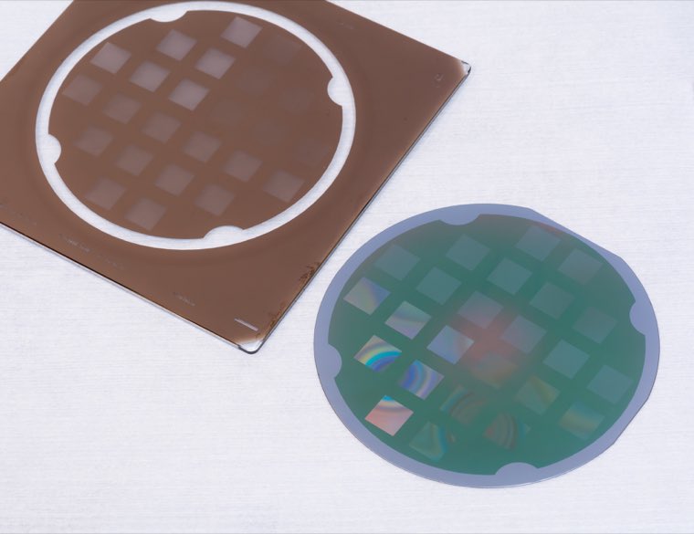 Two patterned wafers side by side, one brown and one iridescent green